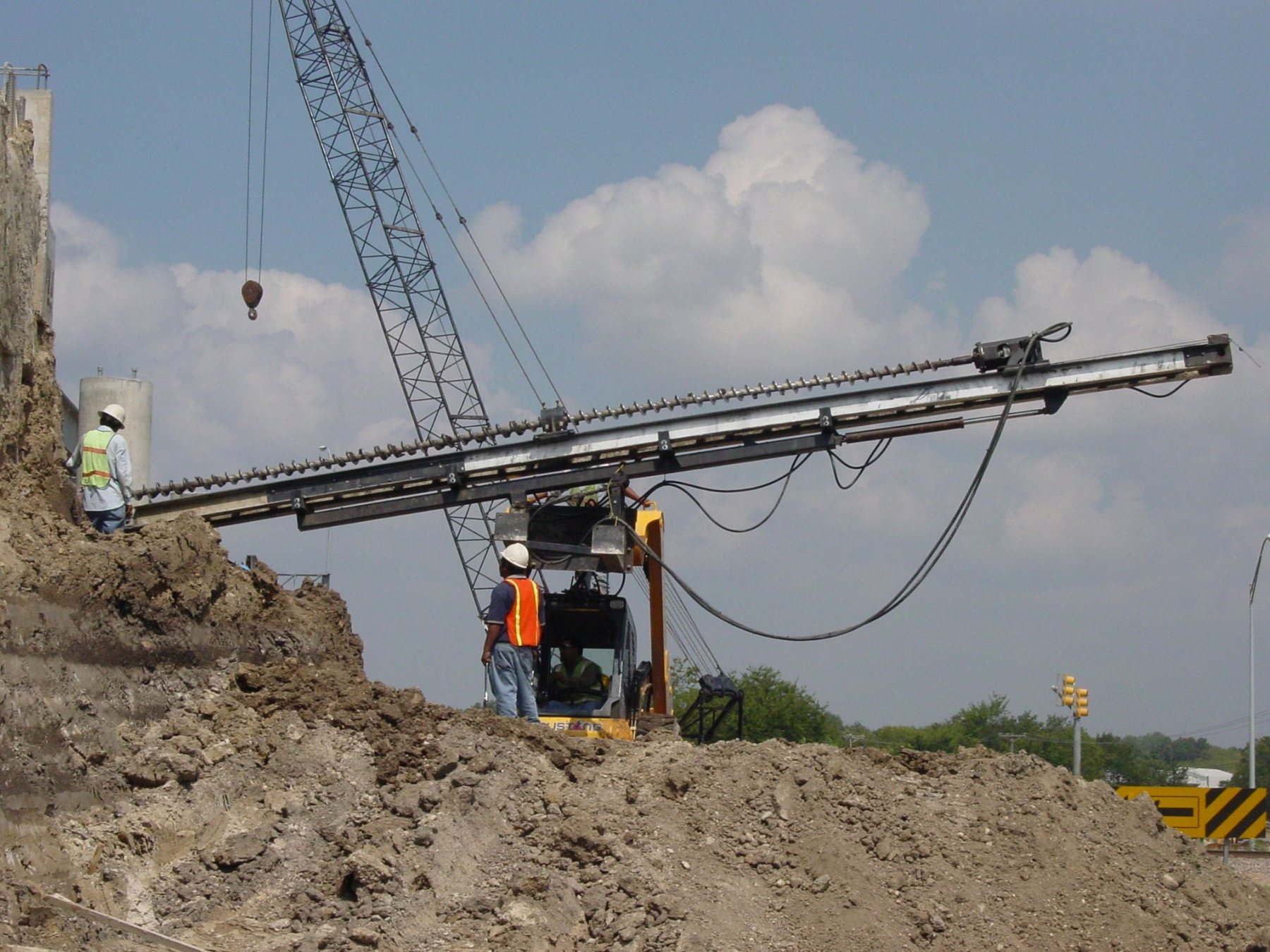Crew working on soil nail wall installation