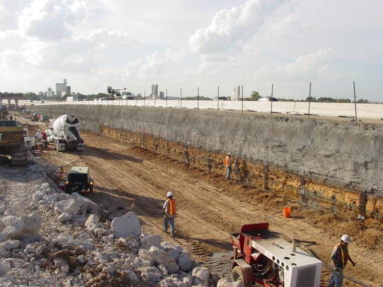 Finished soil nail wall / shotcrete-faced retaining system