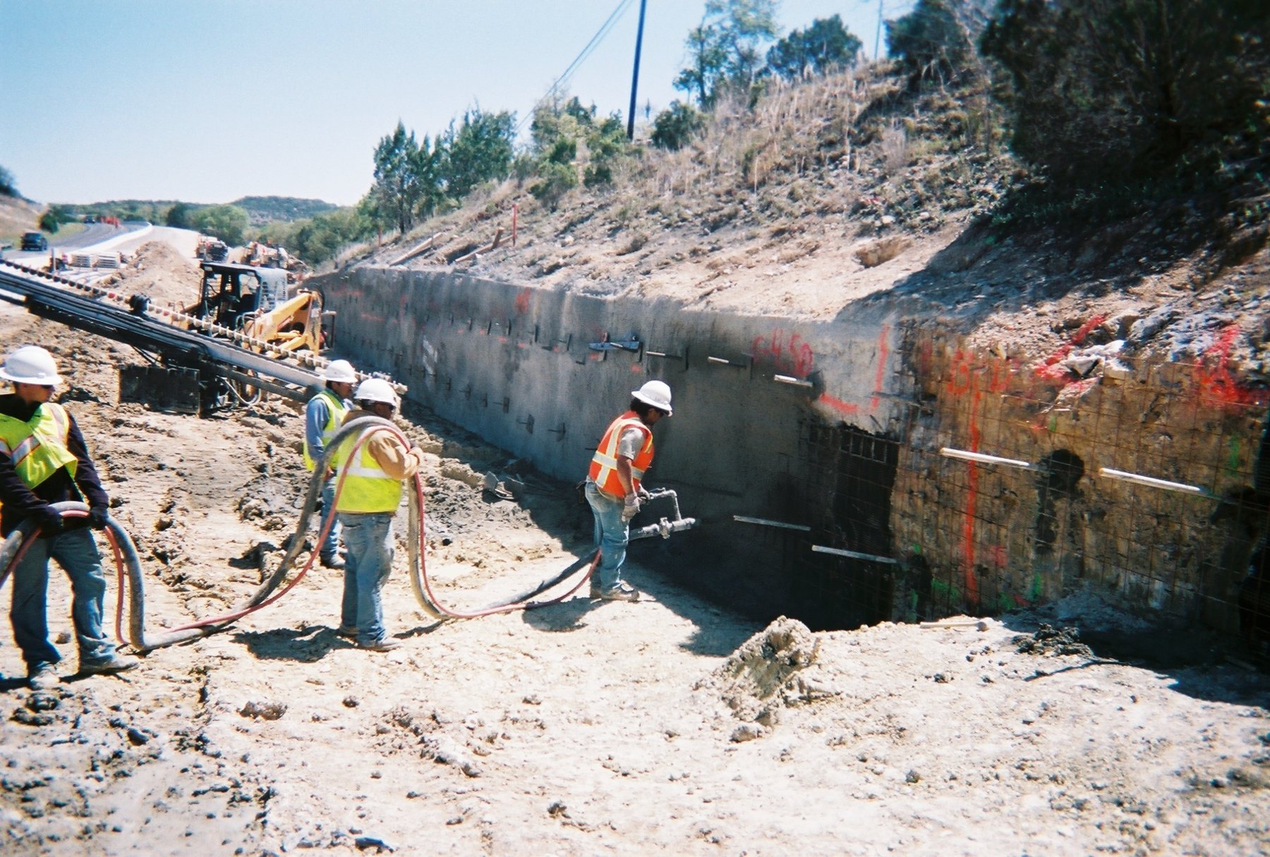 Shotcrete application on soil nail wall system